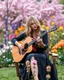 Placeholder: Full a length image Photography Realistic beauty photo lens soft blur Beautiful woman super model blond long hair, casual gown, as guitarist playing acoustic guitar style ,and combination natural plant flowers,she on sitting on big chair,in wonderful park garden flowers background