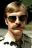 Placeholder: jeffrey dahmer in sheriff uniform with sunglasses and mustache teen