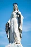 Placeholder: photo of a lady statue made of white marbel with black parts showing a goddoss love