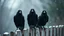 Placeholder: close up photography, three big black crow sitting on top of a wooden fence and looking at the camera, dark thriller mood, shot with sony , winter, high contrast, detailed, high realistic, perfect shoot, professional photography, cinematic