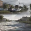 Placeholder: **Cinematic Art:** An intriguing interactive documentary allows viewers to explore a virtual flood-prone city. By clicking on different areas, viewers discover potential flood risks and the effectiveness of various mitigation strategies. The documentary uses data visualization to depict storm surge, flood plains, and the impact of improved drainage systems. **Appearance:** Cinematic art ideas that encompass the essence of constructing and optimizing infrastructures to mitigate flood and stormwat