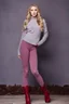 Placeholder: beautiful 18 year old girl with ash blonde hair and blue eyes with her curvy hair down, wearing a long-sleeved woollen top, and lilac long leggings, with long red boots full body shot