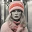 Placeholder: Monica vitti, in the metro in the style of a polaroid,, white, pink,orange, red, with a knitted hat