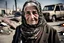 Placeholder: Leica environmental portrait of elderly woman in Gaza, on a street bombed by the Israeli army