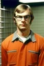 Placeholder: Young Jeffrey Dahmer in prison uniform in jail