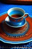 Placeholder: tea on blue Persian rug