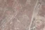 Placeholder: scratched concrete floor, low angle
