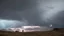 Placeholder: Doctors Without Borders provides immediate medical aid during humanitarian emergencies.Rainbow symbol of peace up on the sky,Photo-realistic scene ,desolate, standing on a jagged cliff, overlooking turbulent, inky black ,A storm brews in the distance, with dark, ominous clouds gathering, powerful beam pierces the darkness, and within its light, ethereal shadows of shipwrecked souls can be seen, their translucent forms forever searching for a way home.