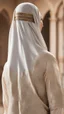 Placeholder: A Muslim woman in Arabic dress with her back to the screen