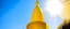 Placeholder: A yellow spire with sunlight designed in ancient Egyptian architectures and sculptures painted by Georges Seurat