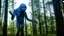 Placeholder: giant humanoid alien emerging from the forest into the plain