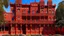 Placeholder: A red palace with fiery crystals designed in Australian aboriginal art painted by Lucas van Leyden