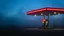 Placeholder: Ethereal gas station at blue hour, bathed in the soft glow of twilight, with an old neon sign flickering, surrounded by mist-shrouded fields and a lone figure standing near the pumps, capturing a sense of mystery and solitude