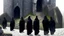 Placeholder: black robe hooded monks in the stone castle