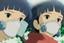 Placeholder: A close-up of Yui and Toshi wearing respirators, their eyes widened in revelation as they discover the connection between the Whispering Pines and their respirators, the trees glowing faintly in the background.