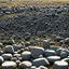 Placeholder: zoom on million of small stones (bokeh high res photo by Ray Harryhausen) fractal Stonehenge made of many little stones, each stone is fractal