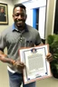 Placeholder: black man holding certificate in USA pants