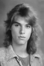 Placeholder: 1980's yearbook photo, teenager, Vince Neil, 14 years old, photorealistic, --ar 9:16 --style raw