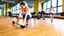 Placeholder: woman makes wood floor dirty in public fitness center