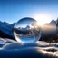 Placeholder: Frozen bubble in front of a snowy mountain landscape, the bubble has wonderful icecrystals and the sun is shining, frozen, cold outside, beautiful small ice flowers in front of the bubble