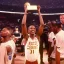 Placeholder: Jalen Brunsen winning the NBA finals at Madison Square Garden and holding the MVP trophy above his head