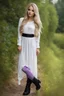 Placeholder: full body standing beautiful 20 year old girl with ash blonde hair and blue eyes with her long hair down, wearing a white sleeved shirt and nice sarifon dress, and lilac long leggings, with long black boots full body shot