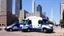 Placeholder: A police Tesla Cybertruck is chasing a Tesla 'Model S Plaid' at top speed, on the Navy Pier, in Chicago. CINEMATIC. WIDE ANGLE LENS. PHOTO REAL.