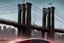 Placeholder: A Tesla's 'Model 3' is racing at top speed, on the 'Brooklyn Bridge' in New York. CINEMATIC. WIDE ANGLE LENS. PHOTO REAL.