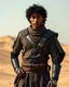 Placeholder: Dune Movie Character fullbody stand on the desert Young Man black curly hair Warrior futuristic clothing deep blue eyes in Dune Movie Character