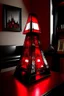 Placeholder: gaming table lamp inspired by avengers stark tower buliding architecture futuristic-modern stlye. piramid form, red and black color scheme