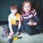 Placeholder:  creepy photo of unusual children with lego cat