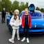 Placeholder: Greta Thunberg holding driving a tesla