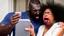 Placeholder: angry black lady screams at her phone while Tyrone who is in his own basement else is laughing at her at the phone