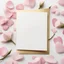 Placeholder: A photo of a white card, 5.5 by 4.25 inches. The card is vertically positioned on a beautiful white surface, positioned between pink rose petals and litte golden hearts.