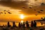 Placeholder: families sitting on a beach lagoon, birds in the sky, sunset