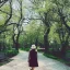 Placeholder: woman walking in park