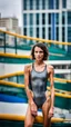 Placeholder: beautiful anorexic young woman, total shot, short shiny anthracite triathlon swimsuit, short brunette wavy bob hair, blurred city background