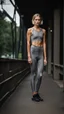 Placeholder: photography of a beautiful anorexic woman, grey satin triathlon top, sports illustrated, blond short wavy bob haircut, pronounced sternum, flat chest, anthracite cycling leggins