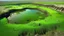 Placeholder: Broken compound beneath a plateau in a coastal swamp with fertile ground and potable water from tanks.