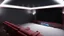 Placeholder: Generate an image of a sleek home cinema with our top-notch projectors and surround sound systems with a star-lined ceiling similar to a Rolls Royce in a high-rise penthouse