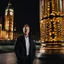 Placeholder: an man standing in front of big ben looking at camera,closeup