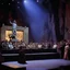 Placeholder: [colour high res photo: Jason and the Argonauts (1963) n the eerie glow of a dimly lit comedy club, the stage was set for a performance unlike any other. The audience, a mix of the living and the undead, eagerly awaited the arrival of the stand-up artist who had risen from the grave to deliver his twisted brand of humor. As the spotlight flickered to life, revealing a figure clad in tattered clothes and sporting a ghostly pallor, the crowd erupted in a mix of laughter and nervous anticipation.