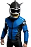 Placeholder: Surfsharks superhero costume combines a black, form-fitting bodysuit with a deep ocean-blue wetsuit-style jacket, featuring shark fin-like shoulder embellishments. White shark tooth designs adorn the arms and legs. His cowl resembles a shark's head, with a dark visor revealing his piercing brown eyes, there is a shark fin ontop of his helmet and on his back. The chest emblem is a stylized shark with dorsal fins reminiscent of Batman's bat symbol