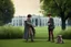 Placeholder: realistic young Harry Potter talking to Dobby in front of white house