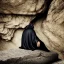 Placeholder: black-robed man sleeping on his back on a stone slab in a large cave