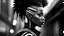 Placeholder: minimal profile of a female African cyberpunk wizard with a striking mohawk hairstyle and intricate shaved patterns on the side of their head, wearing a black and white horizontal thin striped shirt. The background is a blurred, high-contrast mix of black and white lines, suggesting motion and urban settings; overheat, dramatic, cinematic, sudden jolt dynamics, great parallels, great reflections, unsettling shadows, surreal futurist architecture art, surreal liminal space, tribal style,