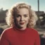 Placeholder: Childish Norma jeane baker in a red woollen sweater, in the sun