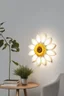 Placeholder: Wall lamp inspired by sunflower ,modern aesthetic , versality and yellow color scheme