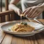 Placeholder: Crea un piatto di spaghetti alla carbonara in the wood table