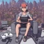 Placeholder: trans playing video games on en enormous gaming set up in a middle of a city